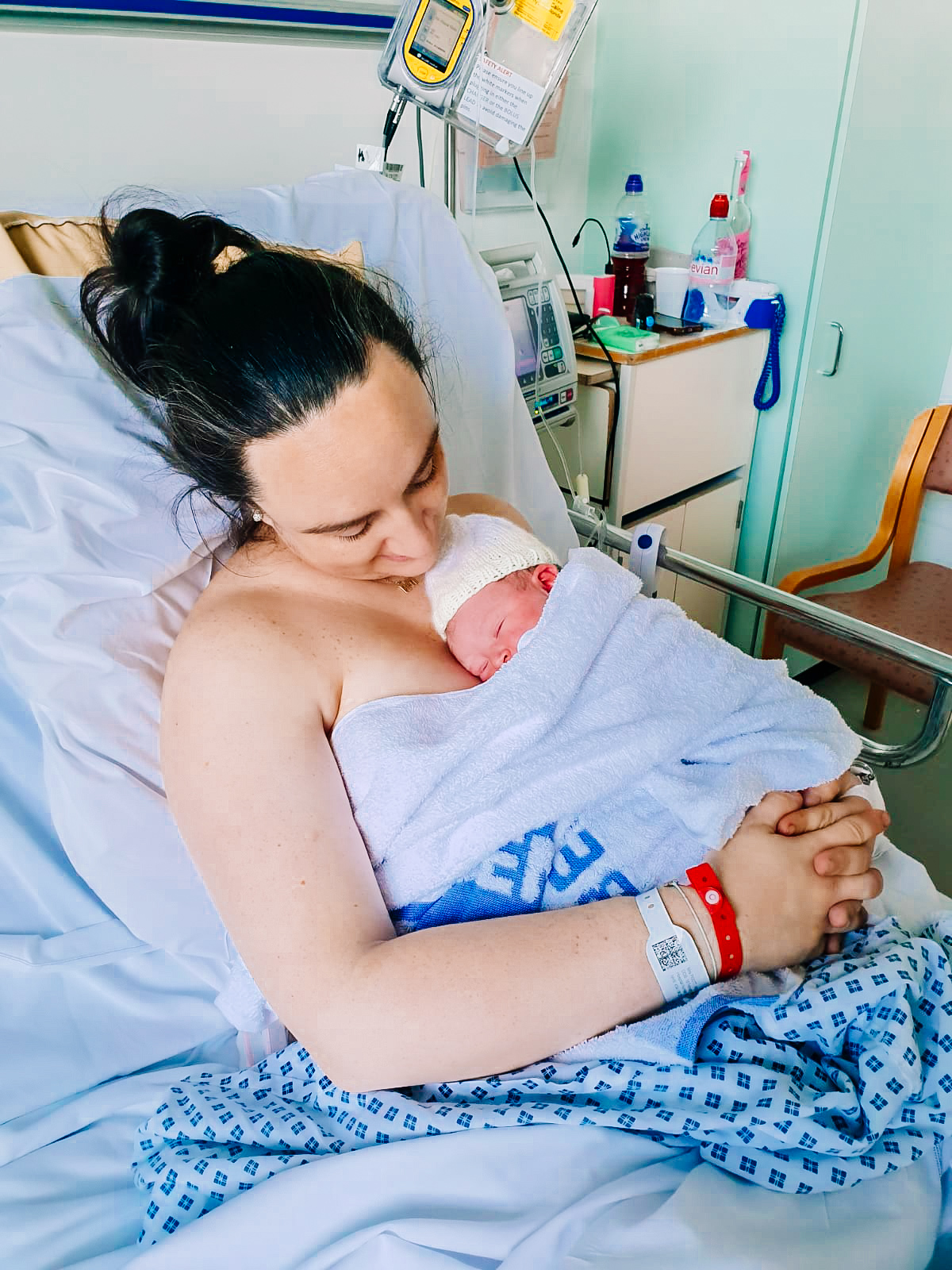 Photo of mum and newborn in hospital bed 
